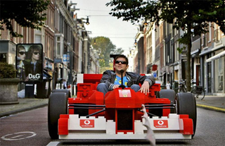 Illustration for article titled 80,000-Brick Lego Ferrari F1 Needs Giant Schumacher Minifig